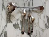silver spoons and silver spoons on a marble table