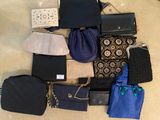 a lot of purses that are sitting on the floor