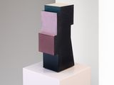 an image of a sculpture made out of blocks on a white pedestal