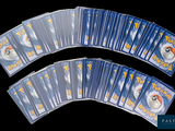 a lot of pokemon cards on a black background