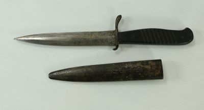 two knives that are laying next to each other on a table