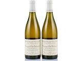 two bottles of white wine sitting next to each other on a white surface
