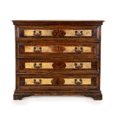 an antique chest of drawers with gold and black designs on the drawers