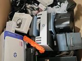 a cardboard box full of electronic equipment in it