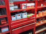 a red shelving with lots of different items on it