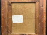 an old picture frame with a piece of paper taped to it