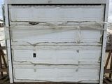 a large white refrigerator sitting on top of a wooden pallet
