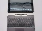 a laptop and a tablet sitting next to each other on a table