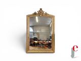 a mirror that is sitting on the wall in the room
