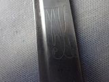 a close up of a knife that has a design on it