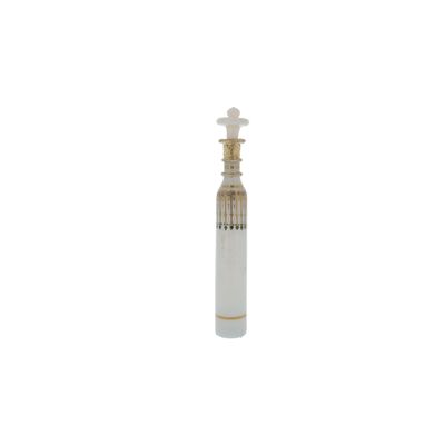 a close up of a bottle of perfume on a white background