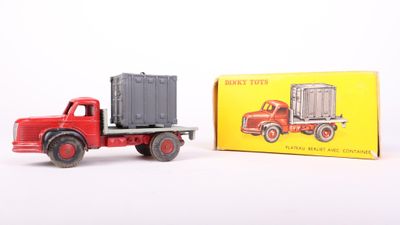 a toy truck with a container on the back of it