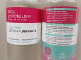 two bottles of clean skin lotion on a table