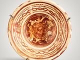 an image of a brown and white bowl with designs on it