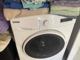 a washer and dryer in a small room