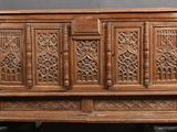an old wooden chest with carvings and carvings on the doors
