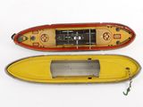 two small boats sitting side by side on a white surface