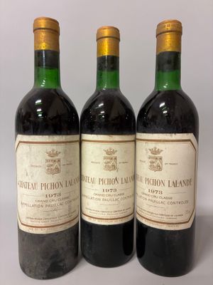 three bottles of wine sitting on top of a table next to each other