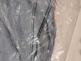 a pair of blue jeans wrapped in plastic on a table