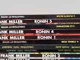 several books stacked on top of each other on a table