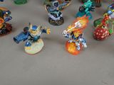 many figurines of different types and colors on the table