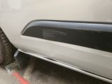 a close up of a white car with a flat tire
