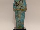 a close up of a statue of a person on a pedestal