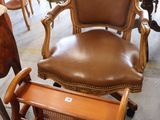 a chair that is sitting next to a table