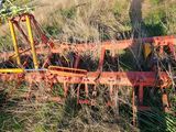 a small tractor that is sitting in the grass