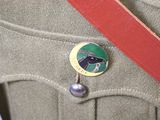 a badge on the back of a man ' s uniform