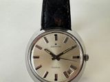 an image of a close up of a wrist watch on a white surface