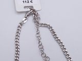 a close up of a silver chain with a tag on it