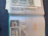 a lot of stamps on a folder on the table