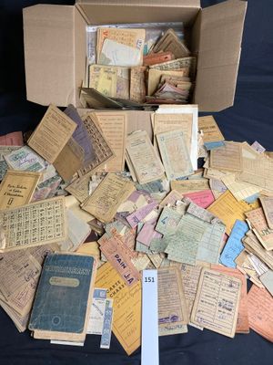 a box full of old paper and a bunch of old books