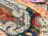 many different colored ties laid out together on a table