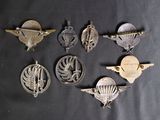 several different types of military badges on a black background