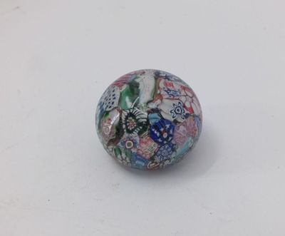 a close up of a glass bead on a white surface