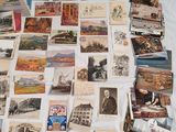 a lot of old postcards on the table