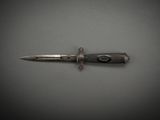 a small knife that is laying on a table