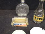 a bottle of ginzano, a glass bottle of ginzano, a bowl of ginzano, and a bottle of ginzano
