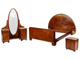 a wooden bed with a mirror and a chest of drawers
