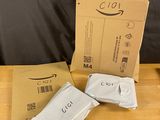 three packages of toilet paper sitting on top of a wooden table