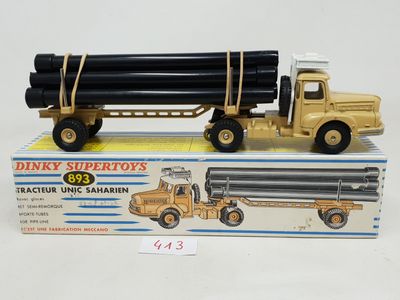 a toy truck with a large pipe attached to it ' s back