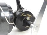 a close up of a fishing reel with a handle