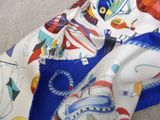 a close up of a scarf with a picture on it