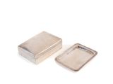 two small silver boxes with lids on a white surface