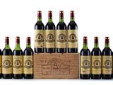 a group of six bottles of wine in a wooden box