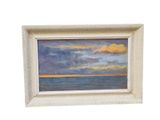 an oil painting of a sunset over the ocean in a white frame