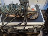 an image of a couple of hoses sitting on top of a metal case