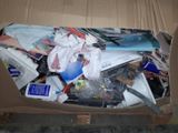 a cardboard box full of assorted items in it